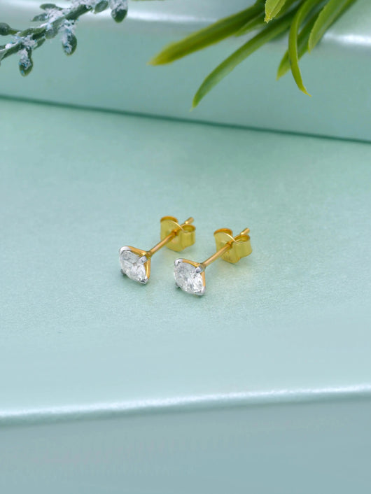 14K Solid Gold 5mm Moissanite Stud Earrings by Carat For You on a creative background.