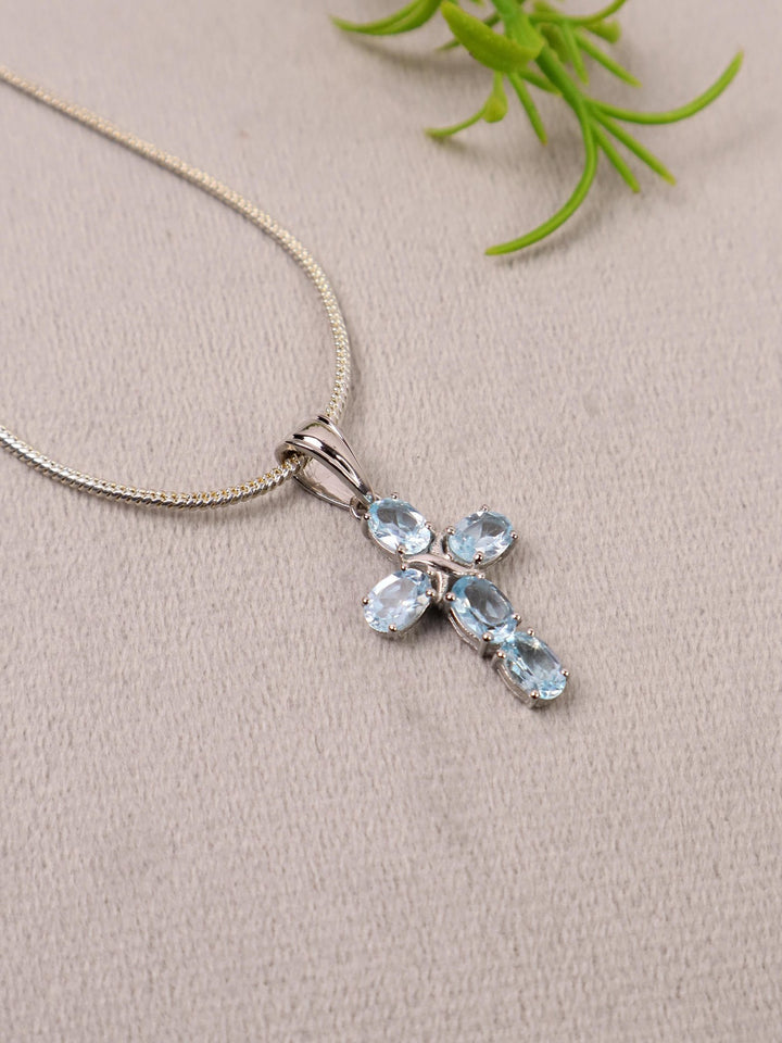 A closeup image of Celestial Cross Blue Topaz Pendant -4 by Carat For You 