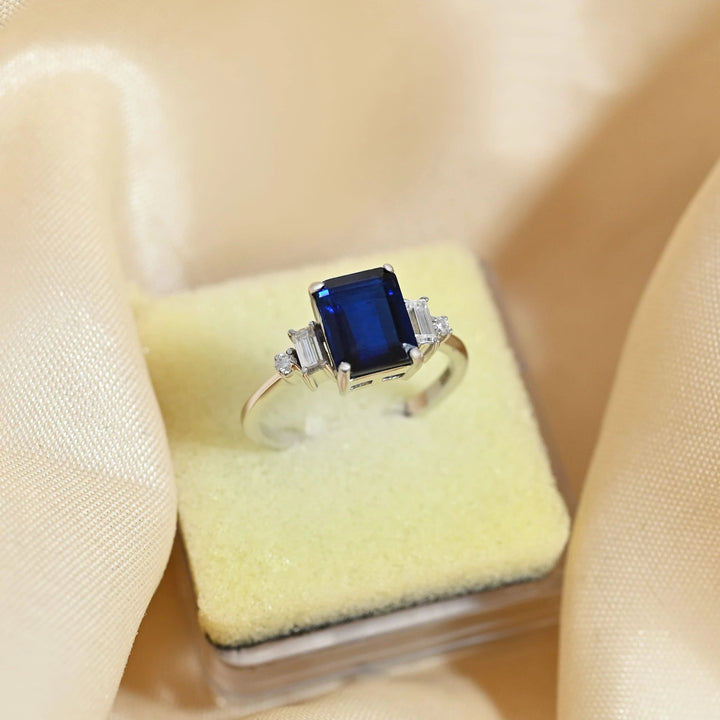 Certified Natural Emerald Cut Blue Kyanite & Moissanite Gemstone Engagement Ring - 925 Sterling Silver By Carat For You on creative background