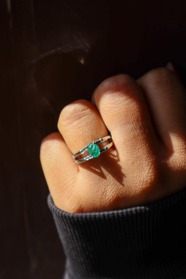 A closeup image of a girl wearing Emerald Solitaire Ring -1 by Carat For You 