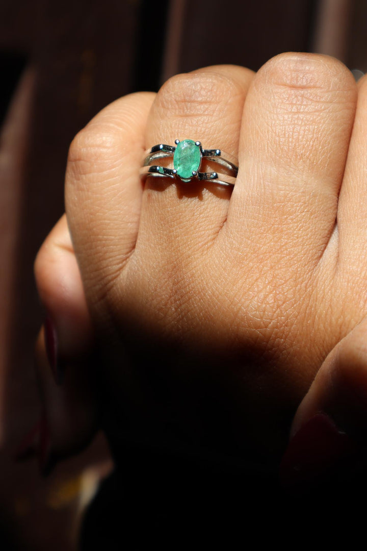 A closeup image of a girl wearing Emerald Solitaire Ring 3 by Carat For You 