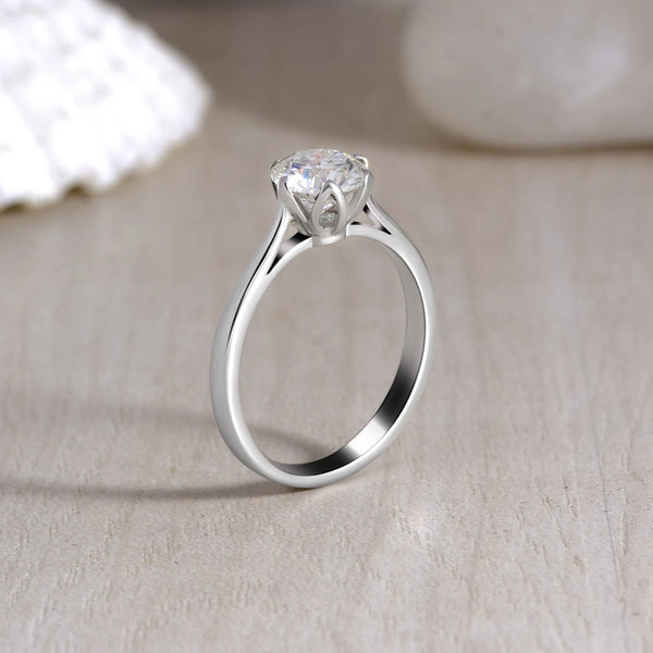 Floral Prong Moissanite Solitaire Ring - 925 Sterling Silver with creative background