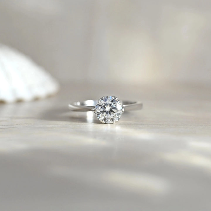 Floral Prong Moissanite Solitaire Ring in 925 Sterling Silver by Carat For You on Creative Background
