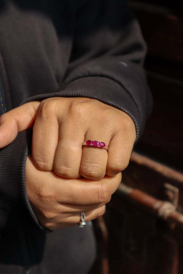 Girl in black sweater wearing Natural Ruby Three Stone Ring in 925 Sterling Silver by Carat For You