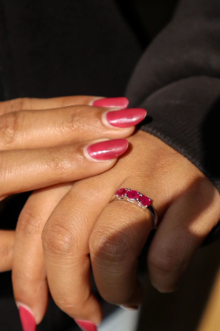 Girl in black sweater wearing Natural Ruby Three Stone Ring in 925 Sterling Silver by Carat For You