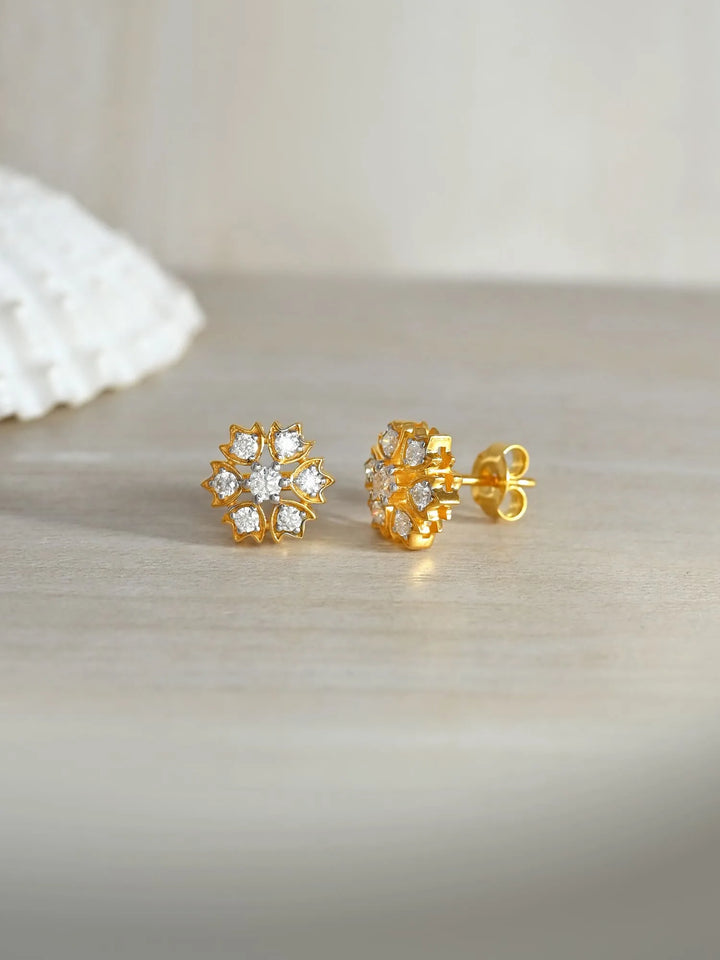 Gold Floral Radiance Moissanite Stud Earrings in 925 Sterling Silver by Carat For You on creative background
