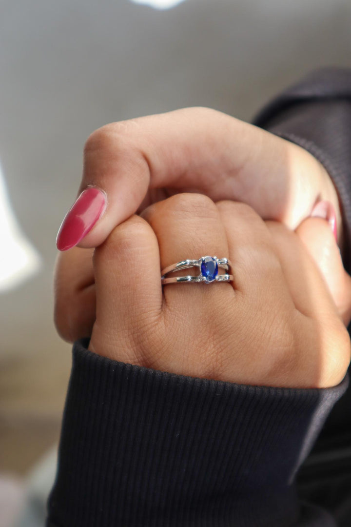 A closeup image of a girl wearing Majestic Blue Sapphire Ring 3 by Carat For You 