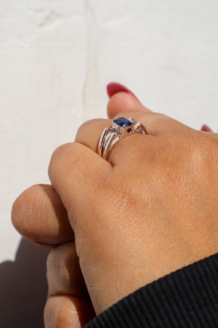 A closeup image of a girl wearing Majestic Blue Sapphire Ring 4 by Carat For You 