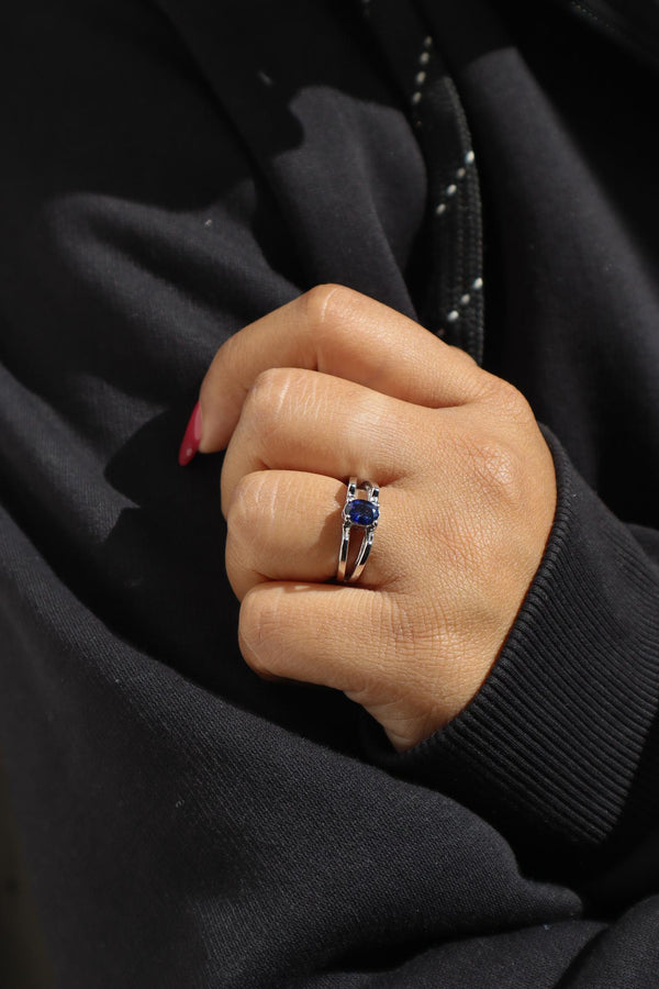 A closeup image of a girl wearing Majestic Blue Sapphire Ring 5 by Carat For You 