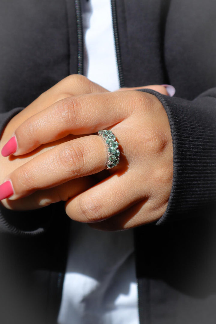 Model wearing Natural Green Sapphire Band Ring in 925 Sterling Silver