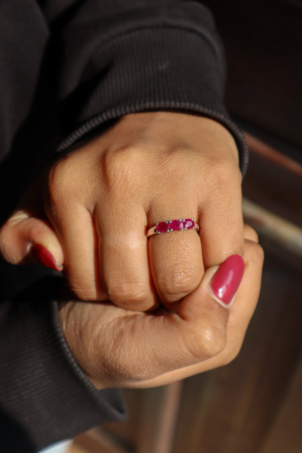 Girl in black sweater wearing Natural Ruby Three Stone Ring