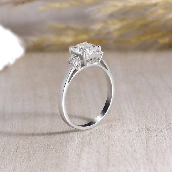 Princess Cut 3 Stone Moissanite Engagement Ring - 925 Sterling Silver with creative background