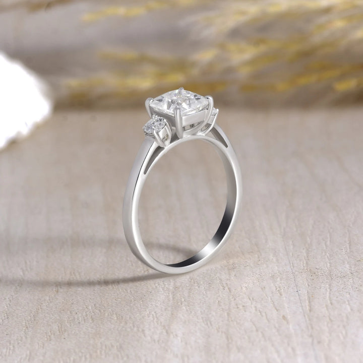 Princess Cut 3 Stone Moissanite Engagement Ring - 925 Sterling Silver with creative background