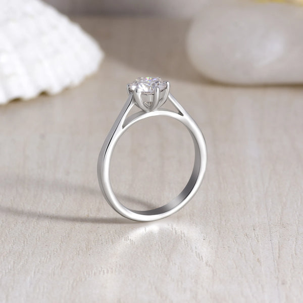Unique 6-Prong Moissanite Solitaire Ring - 925 Sterling Silver with creative background