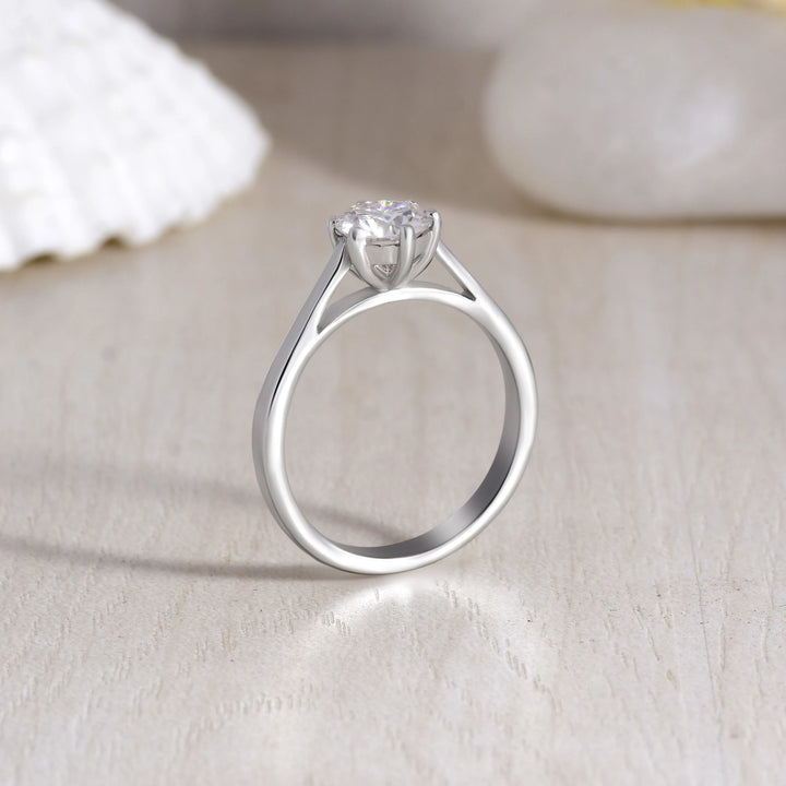 Unique 6-Prong Moissanite Solitaire Ring - 925 Sterling Silver with creative background