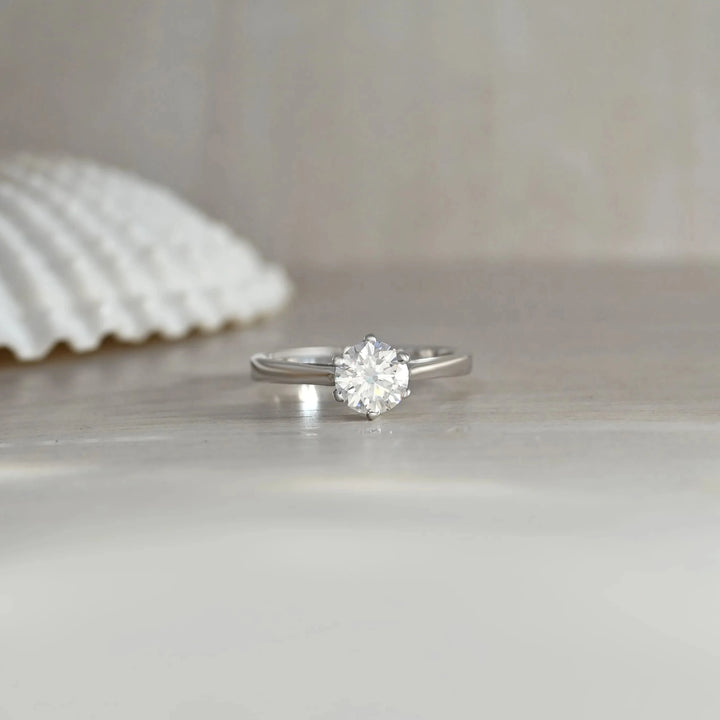 Unique 6-Prong Moissanite Solitaire Ring in 925 Sterling Silver by Carat For You on Creative Background