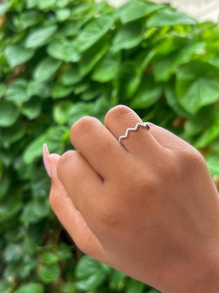 Zigzag Sparkle Moissanite Band Ring by Carat For You on a creative background